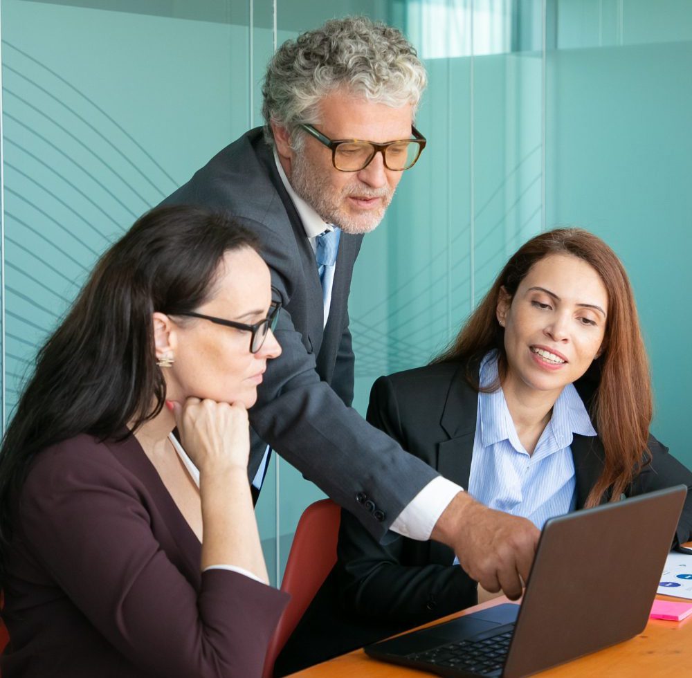 businessman-pointing-screen-showing-project-details-colleague-img-scaled businessman-pointing-screen-showing-project-details-colleague-img