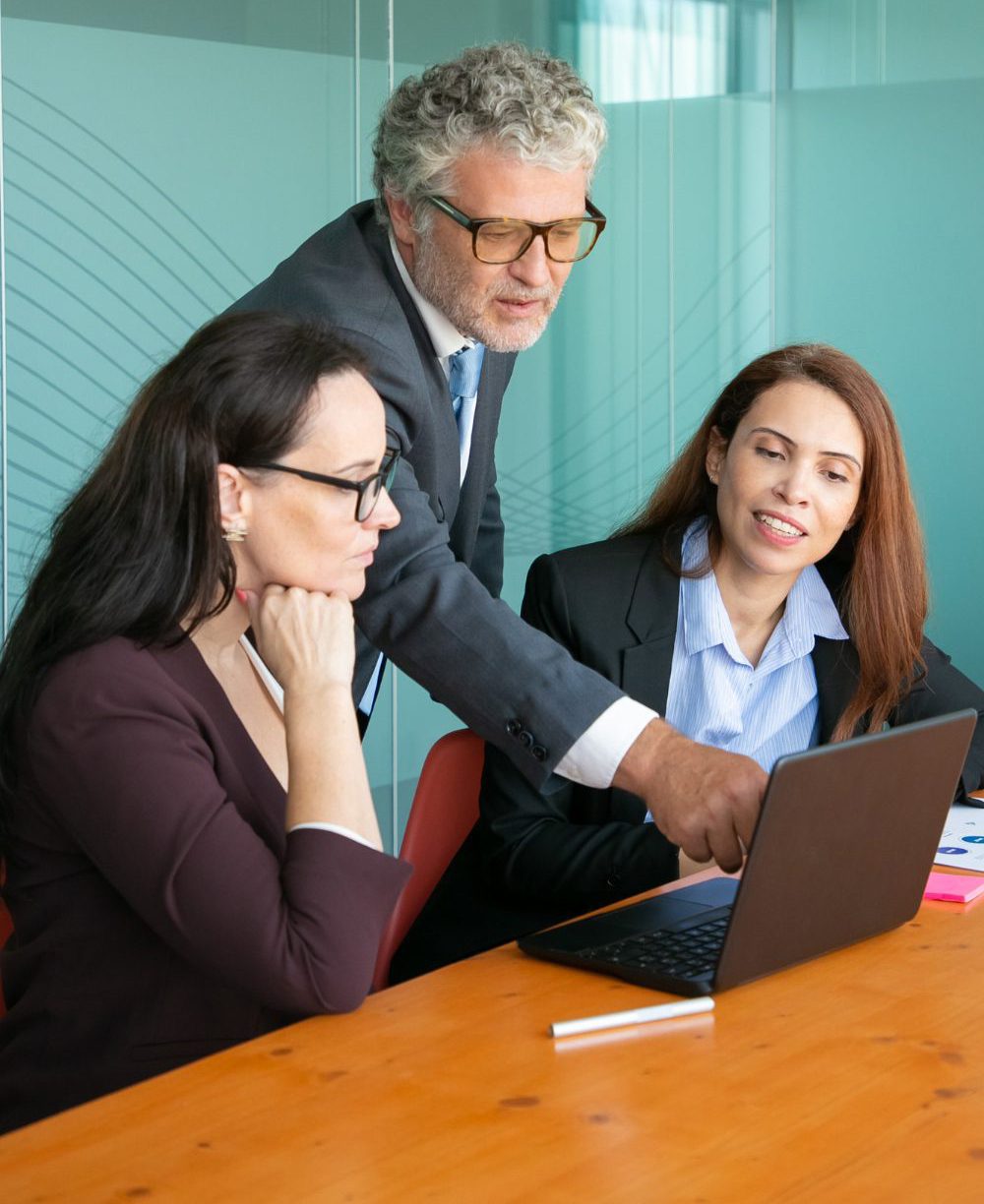 businessman-pointing-screen-showing-project-details-colleague-img businessman-pointing-screen-showing-project-details-colleague-img